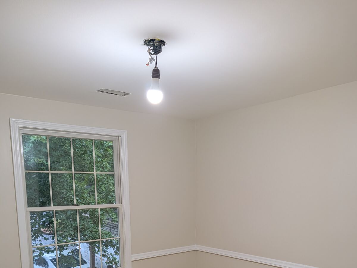 Smooth, repainted ceiling after popcorn texture removal